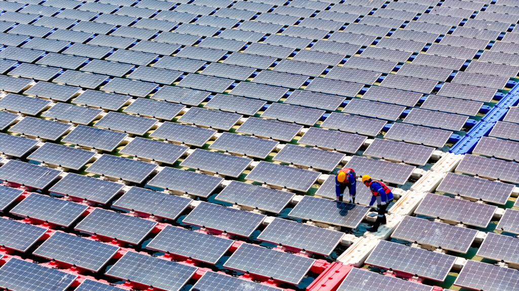 Floating solar panels providing renewable energy. Aerial view floating on solar cells and